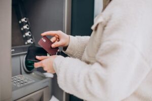 Woman Withdrawing Money at ATM machine